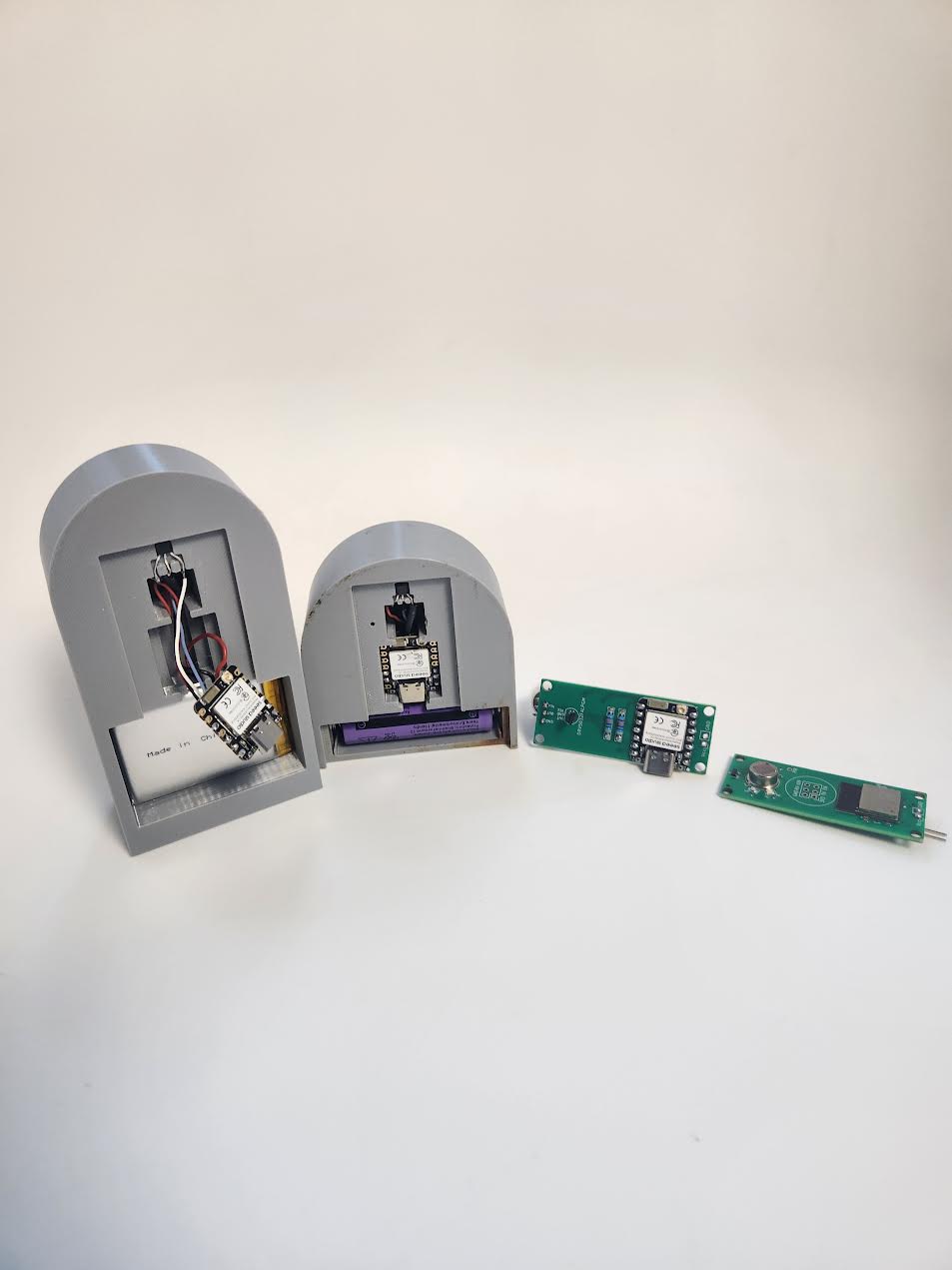 Evolution of PCB versions showing progression from dev board to integrated design